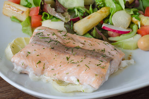 istock Grilled salmon with lemon and asparagus salad 468418925