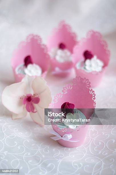 Pink Cupcakes Decorated With Cream And Roses Stock Photo - Download Image Now - 2015, Alberta, Baked