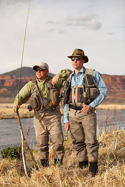 istock Fly Fisherman and his river guide 468424358