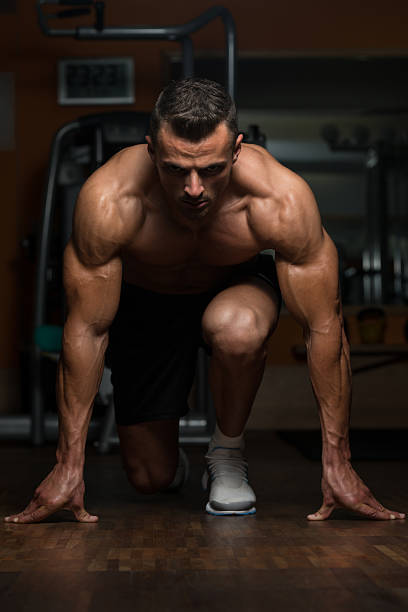istock Strong Muscular Men Kneeling On The Floor 468425634