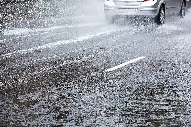 istock A car driving through wet roads 468427209