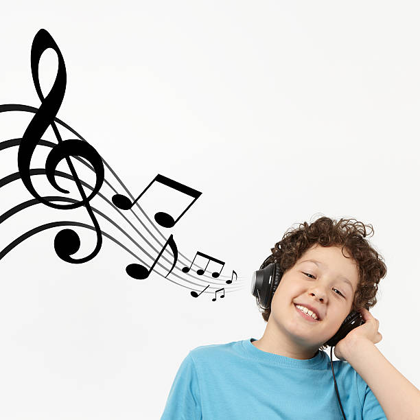 istock Child is listening to music 468427321