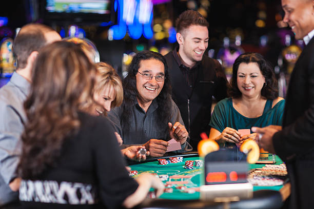 istock Diverse group of people gambling at casino blackjack table 468427705