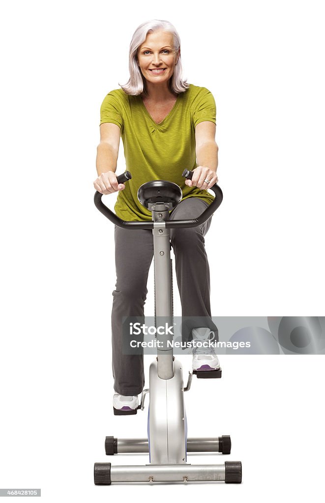 Fitness kobieta na Rower treningowy-izolowano - Zbiór zdjęć royalty-free (Neutralne tło)