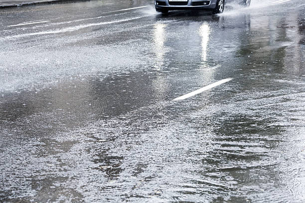 istock Driving in flooded street 468428647