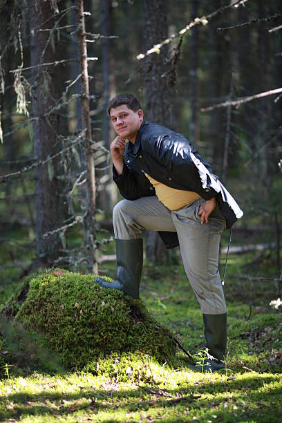 istock young man in a forest tourist 468428722