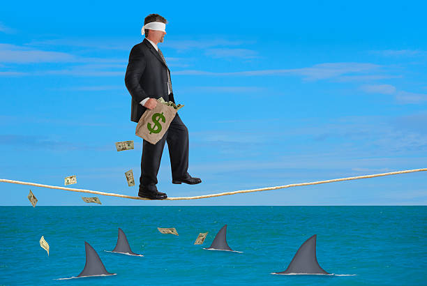 istock Financial Risk Success Plan Blindfolded Man Walking Tightrope 468429758