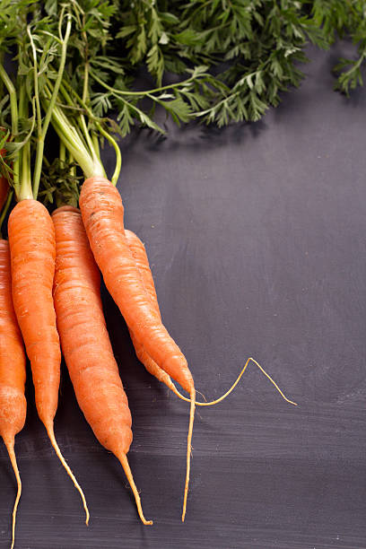 istock Fresh carrot with green leaves 468430277