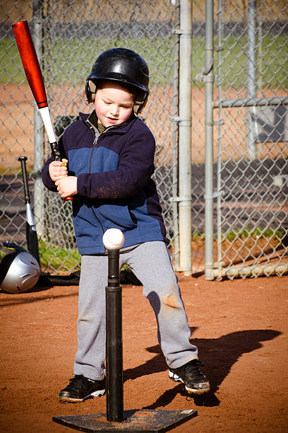 istock Boy batting at T-ball practice 468431281