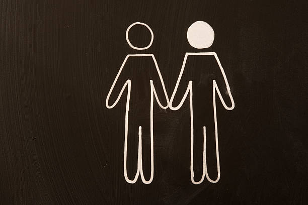 istock two man as happy couple on a blackboard 468433860