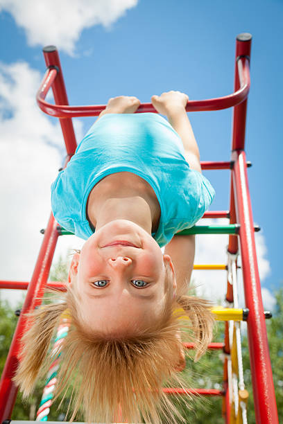 istock Happy child on a jungle gym 468434200