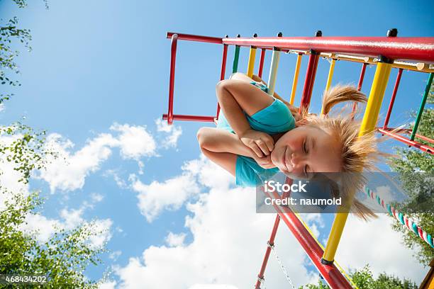 Happy Child On A Jungle Gym Stock Photo - Download Image Now - Playground, Child, Upside Down