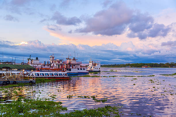 Port of Iquitos, Peru Iquitos, Peru - March 10, 2015: View of the port of Iquitos, Peru at sunset on March 10, 2015.  Iquitos is an Amazonian city with over 500,000 inhabitants. iquitos photos stock pictures, royalty-free photos & images