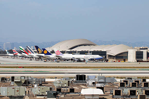 Tom Bradley International Terminal of Los Angeles International Airport Los Angeles, CA, USA - Mar 29, 2014: Lots of wide-body airplanes from various countries were stopped at LAX Tom Bradley International Terminal. british airways stock pictures, royalty-free photos & images