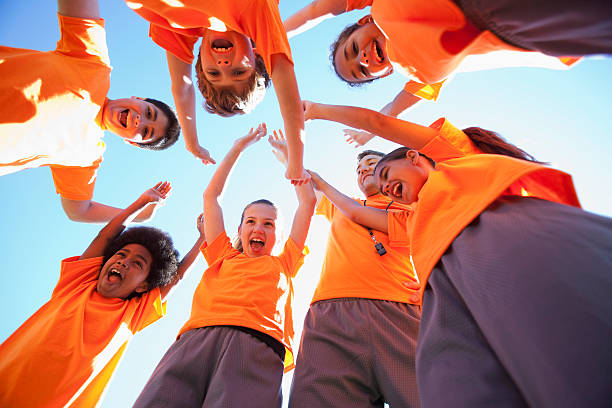 istock Coach with group of children 468438427