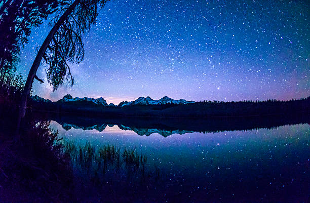 Emerald lake with illuminated cottage under milky way,and Mount Burgess on background,in Yoho national park,British Columbia, Canada.