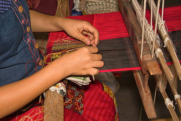 istock Women weaving a cloth  in Chiang Mai 468439550