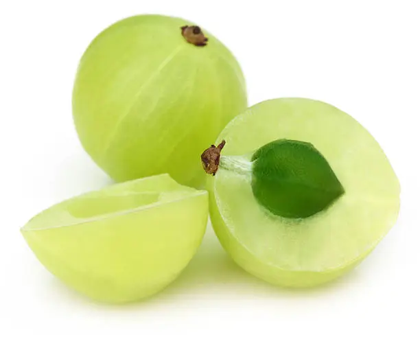 Sliced amla over white background