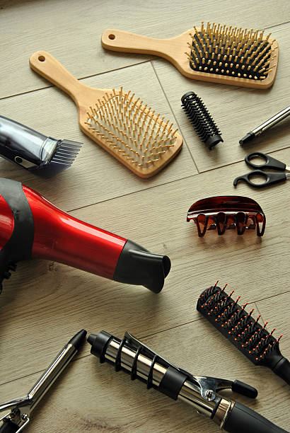istock hairdressing tools on a wooden floor 468439606