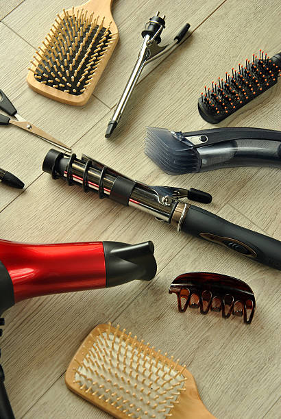 istock hairdressing tools on a wooden floor 468439608