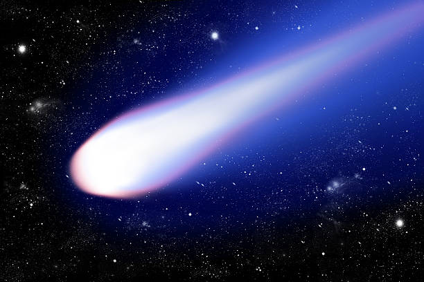 istock blue comet with shiny tail on black starlit space background, 468441844