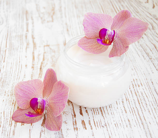 istock Face cream with orchids flowers 468442149