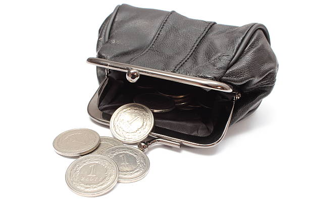 istock Black leather purse with silver coins. White background 468443625