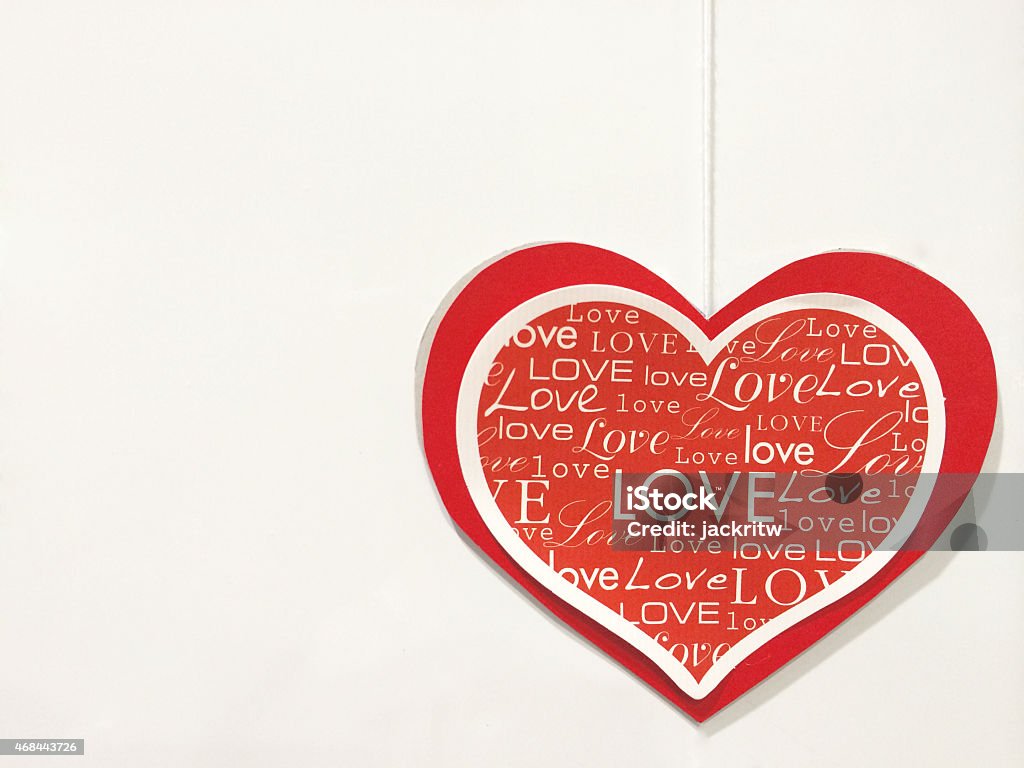 Small Rope Holding Heart at Right Corner Template White Small Rope Holding Red Paper Heart with Multiple Fonts of Love at The Right Corner of White Cream Background used as Template Background Texture 2015 Stock Photo