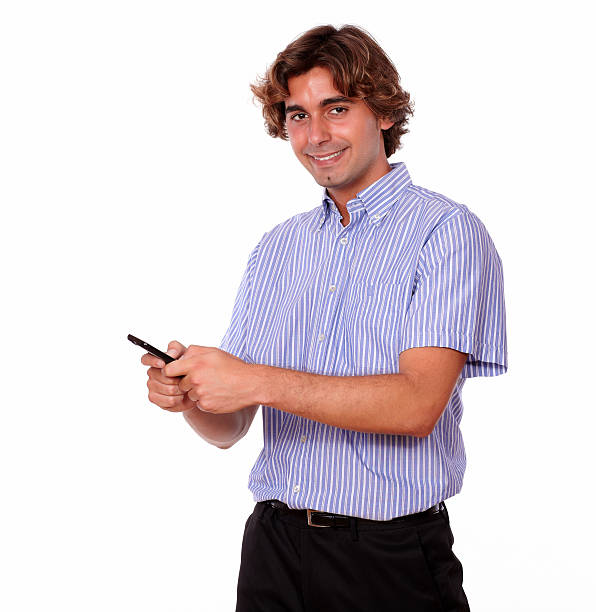 istock Charming young man sending a message by cellphone 468444509