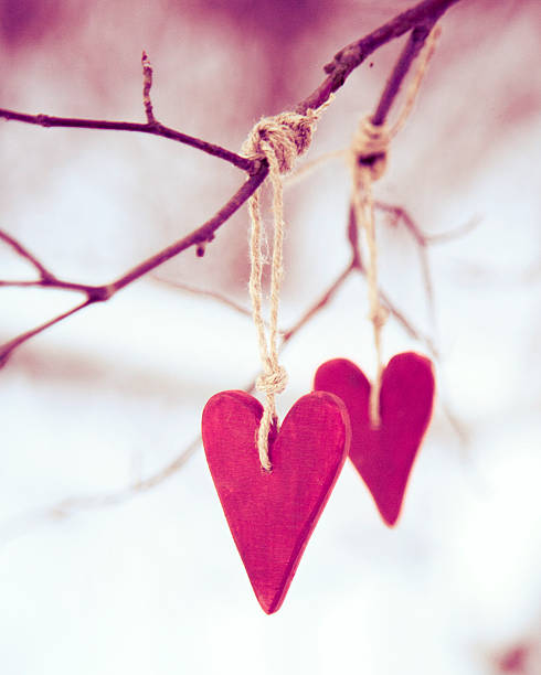 istock heart shaped valentine's / christmas decorations hanging on the tree 468445119