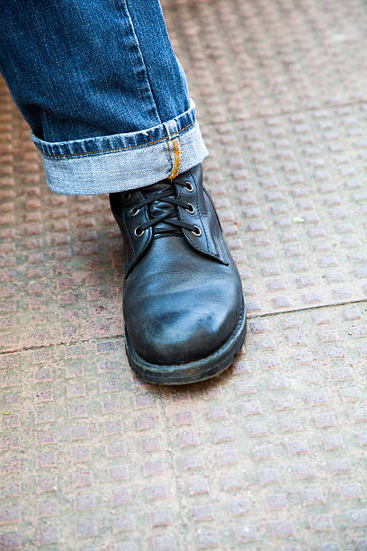 istock Angled laced up leather boot denim jeans.CR2 468445755