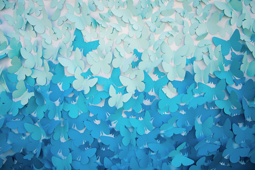 background of blue butterflies made of paper