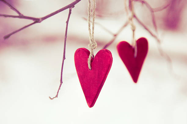 istock Heart shaped wood decorations hanging from a tree 468450273