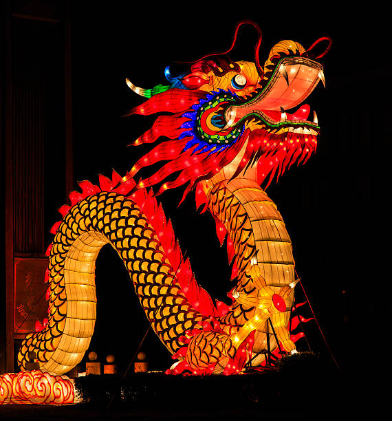 Chinese dragon illuminated in the night stock photo