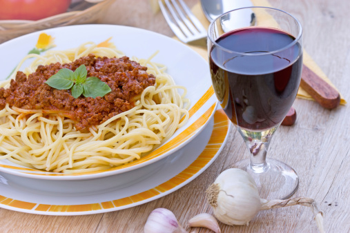 Spaghetti  Bolognese and glass of red wine