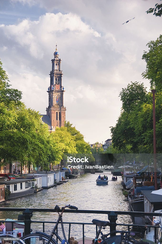 Church and canal in Amsterdam, Netherlands Amsterdam Stock Photo