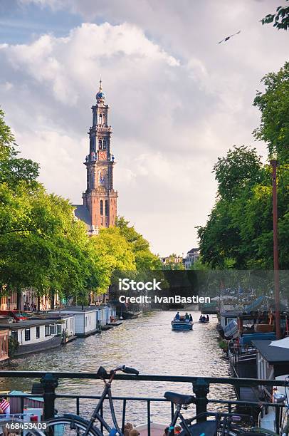 Church And Canal In Amsterdam Netherlands Stock Photo - Download Image Now - Amsterdam, Back Lit, Barge