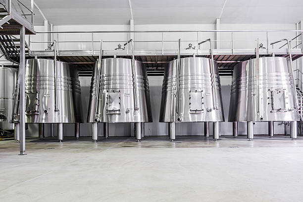 modern wine cellar with stainless steel tanks stock photo