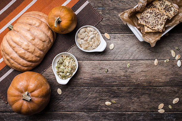 istock Rustic pumpkins with cookies and seeds on wood 468454142