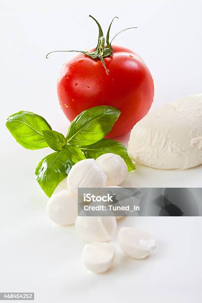 Mozzarella Cheese And Basil Leaves Stock Photo - Download Image Now - 2015, Affectionate, Basil