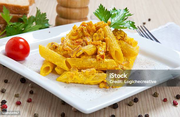 Penne With Speck And Saffron Stock Photo - Download Image Now - Penne, Saffron, Carbonara Sauce