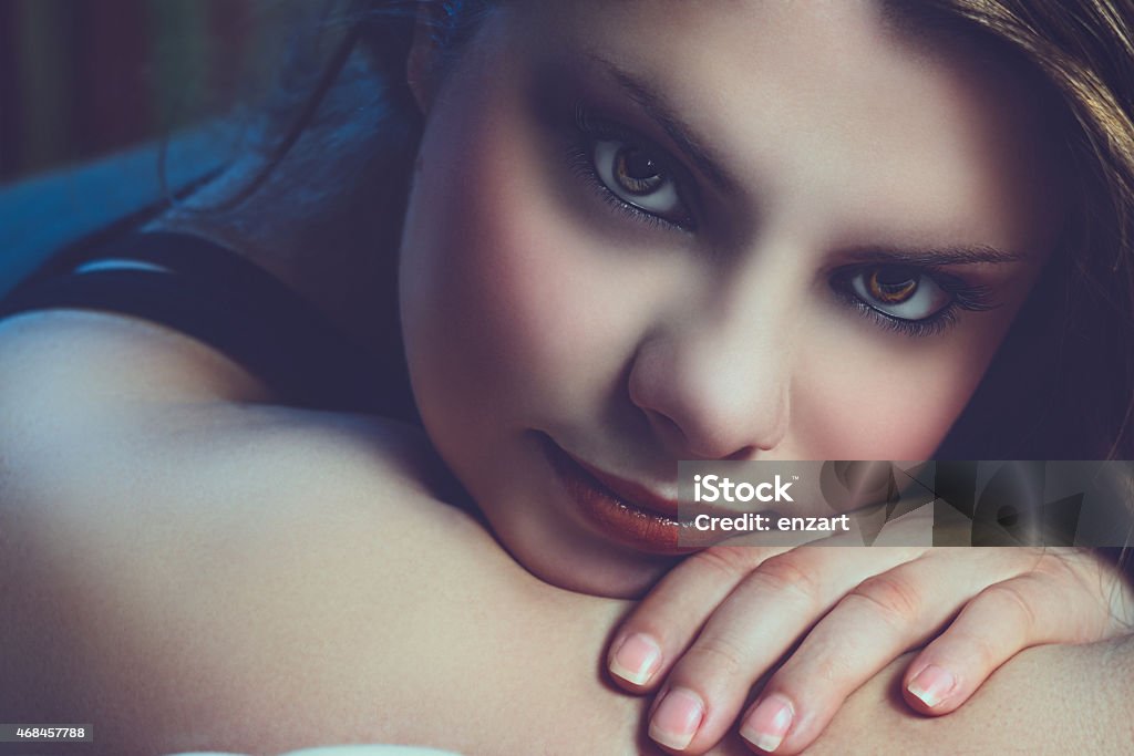 Girl with intense look Eye of the girl in the foreground 2015 Stock Photo