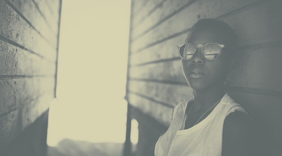 Black and white portrait of a cool African American girl hanging out