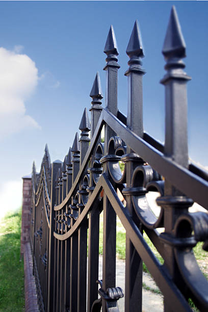 istock Metal fence over blue sky 468459408