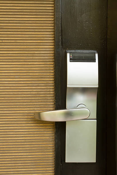istock Electronic lock on door with white key card 468459854