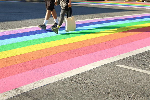 Pride Crosswalk Foot Traffic, Vancouver Vancouver’s first permanently rainbow colored  crosswalk at the intersection of Davie and Bute in downtown Vancouver, British Columbia, Canada. gay pride parade photos stock pictures, royalty-free photos & images