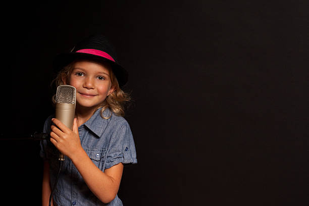 istock Young Girl Holding Microphone Smiling 468460972