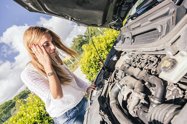 istock Young Woman with Damaged Car 468462029