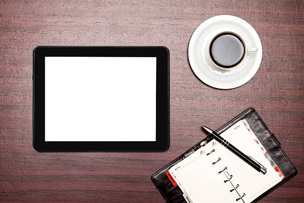 istock empty tablet and a cup of coffee in office 468462037