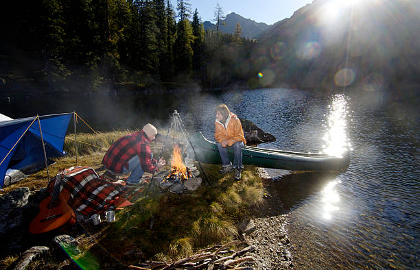 istock Man and woman camping on small island 468464436